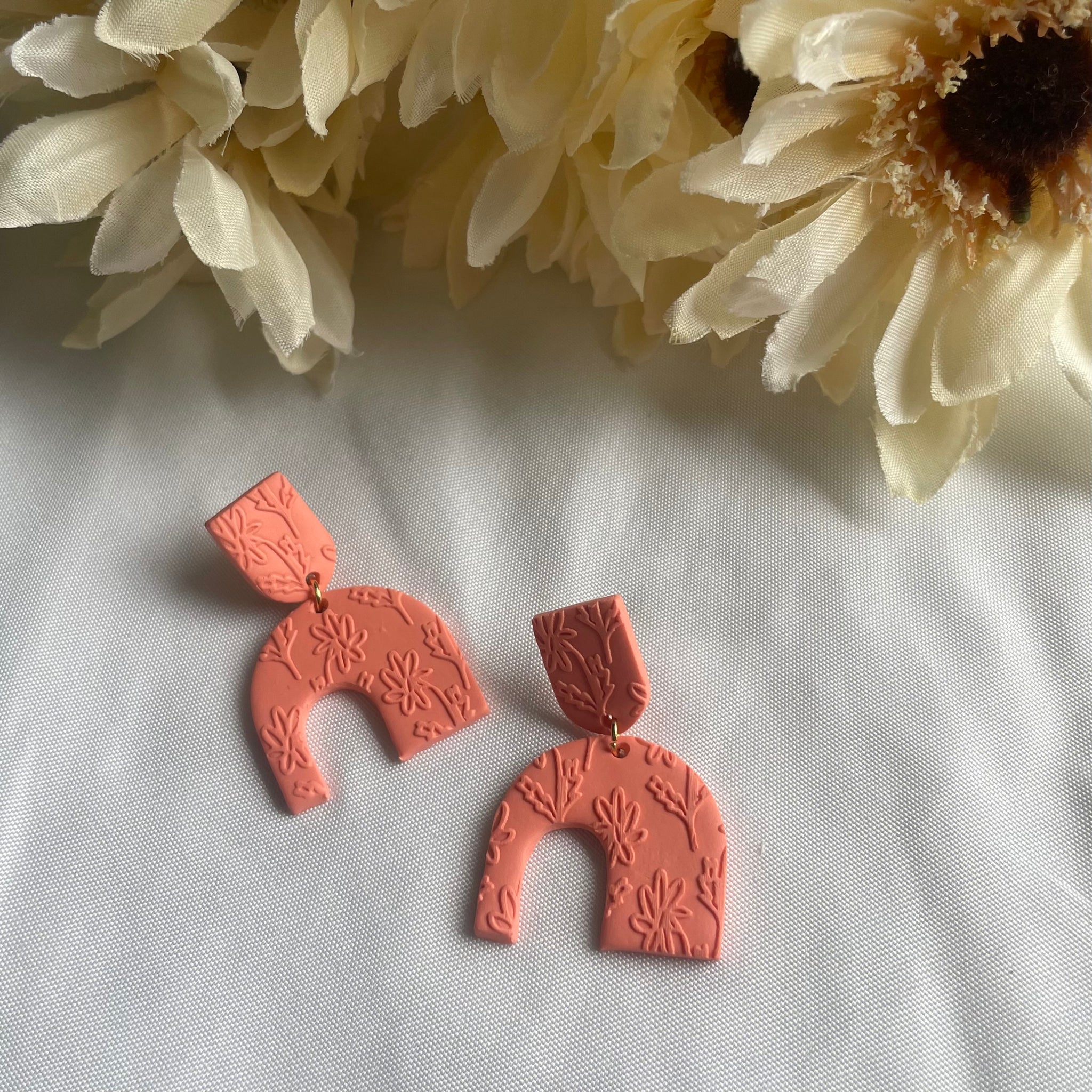 Floral Embossed Asymmetrical Arches